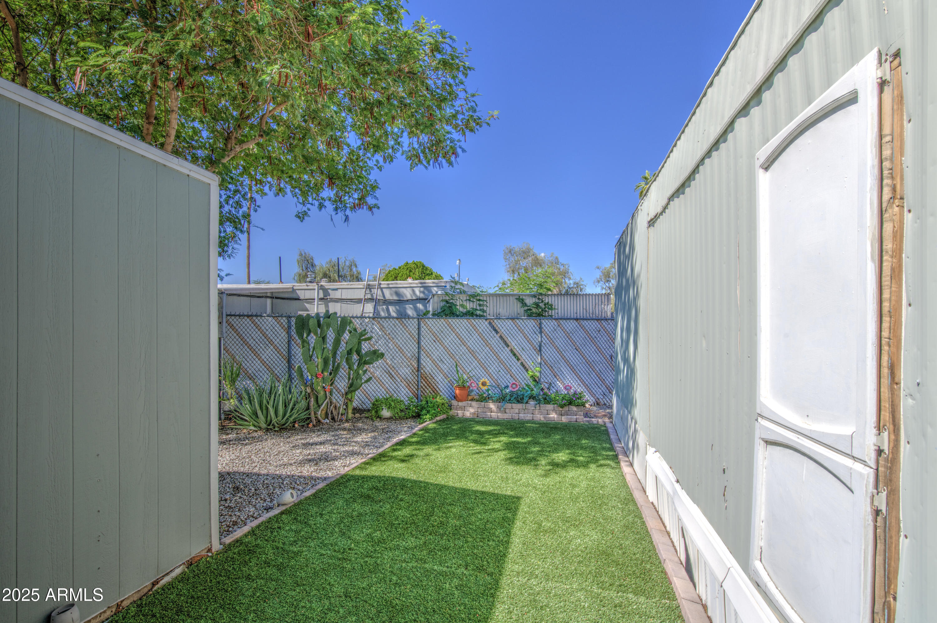 1304 East Bell Road, Unit 43 Phoenix, AZ 85022 - Photo 8 of 9 a view of a back yard from a window