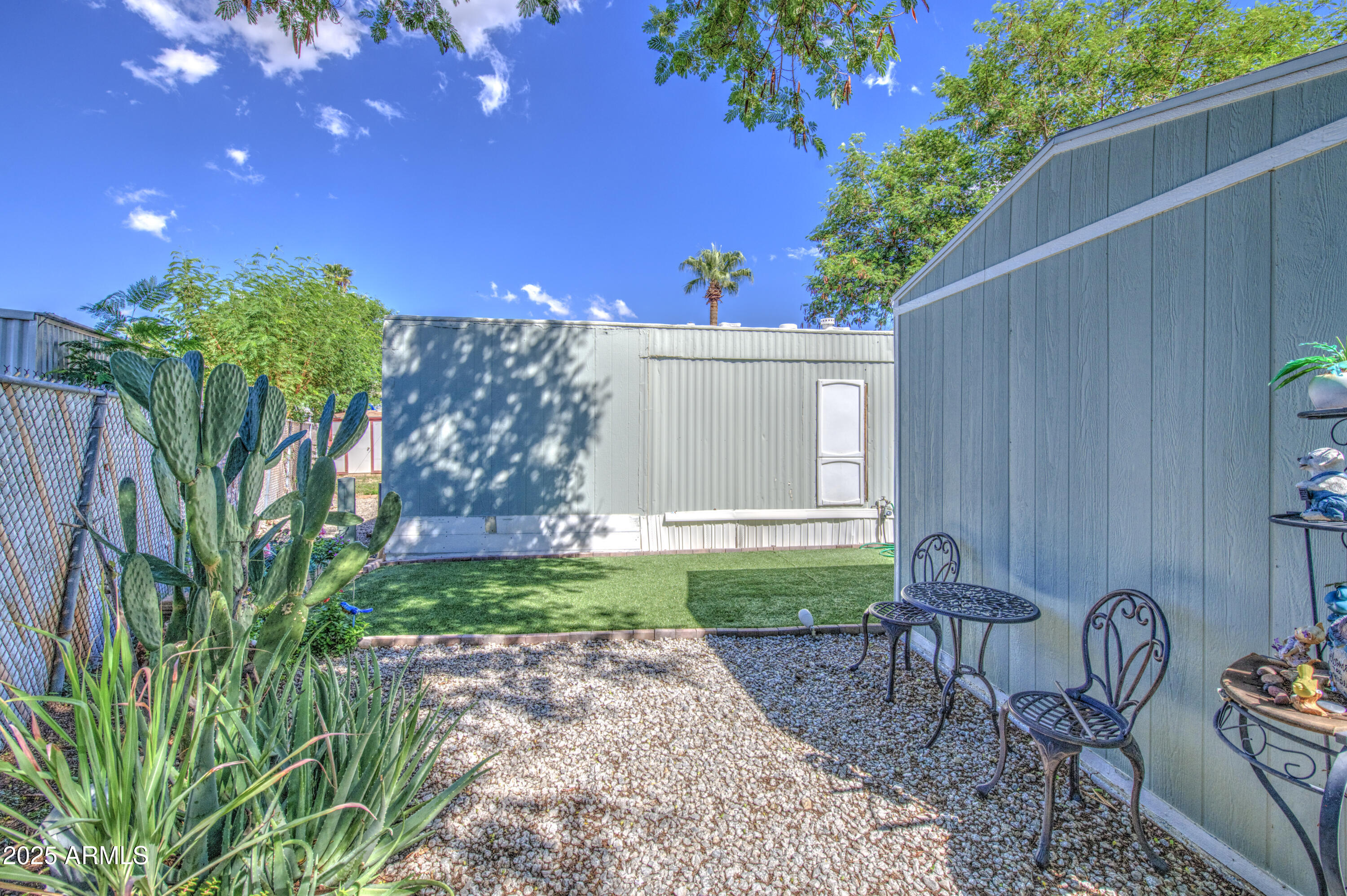 1304 East Bell Road, Unit 43 Phoenix, AZ 85022 - Photo 9 of 9 a view of a backyard with plants and a tree