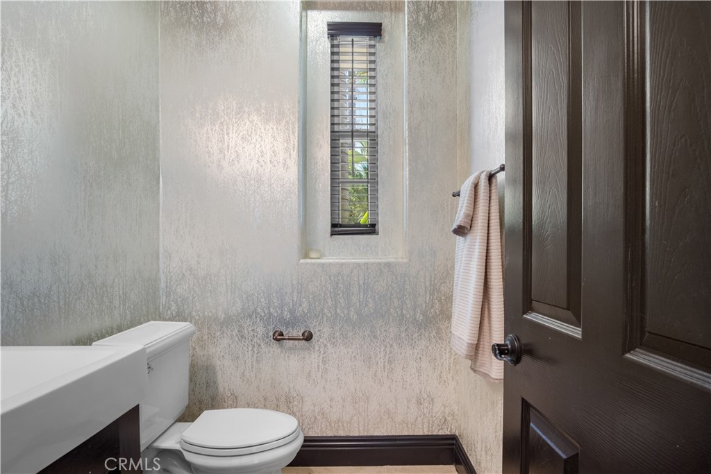 36 Via Divertirse San Clemente, CA 92673 - Photo 22 of 56 a bathroom with a toilet a sink and shower