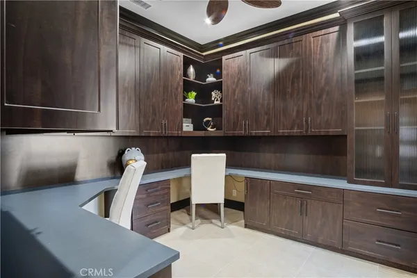 a dining room with a wooden table and chair