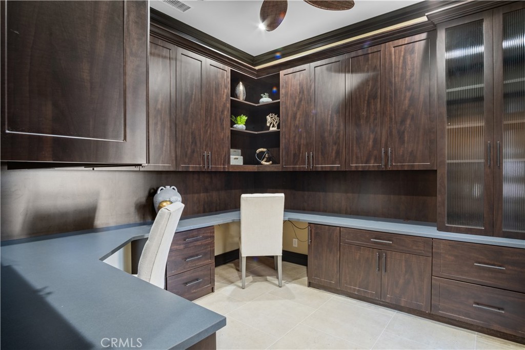 36 Via Divertirse San Clemente, CA 92673 - Photo 26 of 56 a kitchen with a refrigerator and cabinets