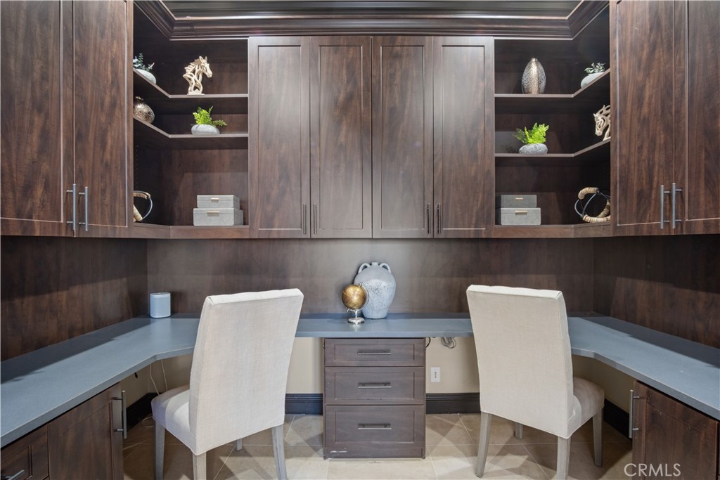 36 Via Divertirse San Clemente, CA 92673 - Photo 27 of 56 a dining room with a wooden table and chair