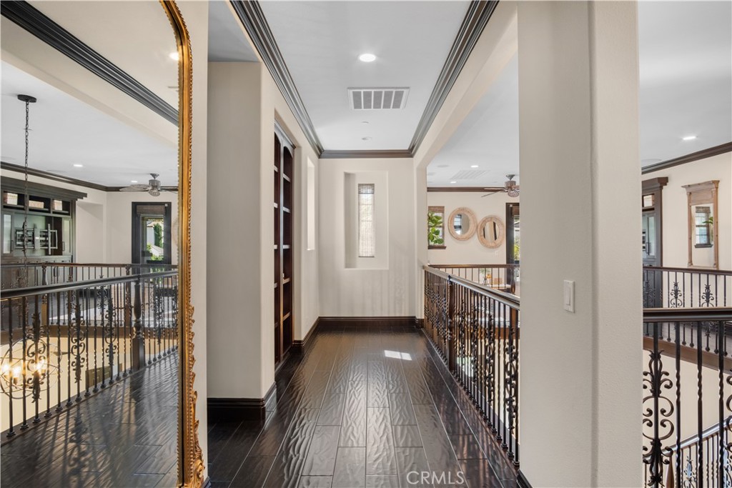 36 Via Divertirse San Clemente, CA 92673 - Photo 36 of 56 a view of a hallway with wooden floor and staircase