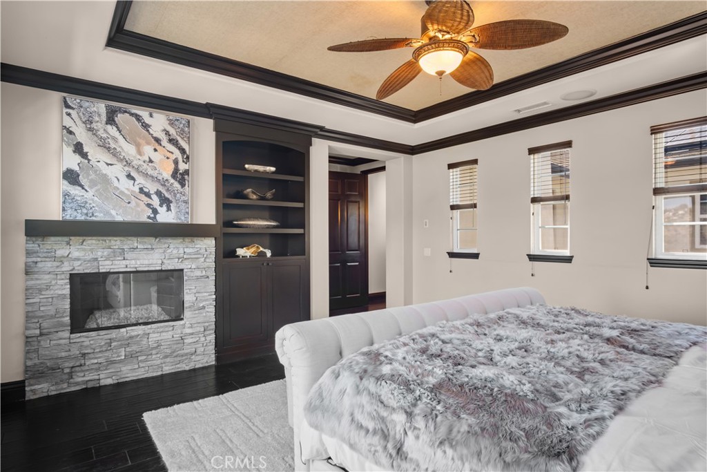 36 Via Divertirse San Clemente, CA 92673 - Photo 43 of 56 a bedroom with a bed and a fireplace