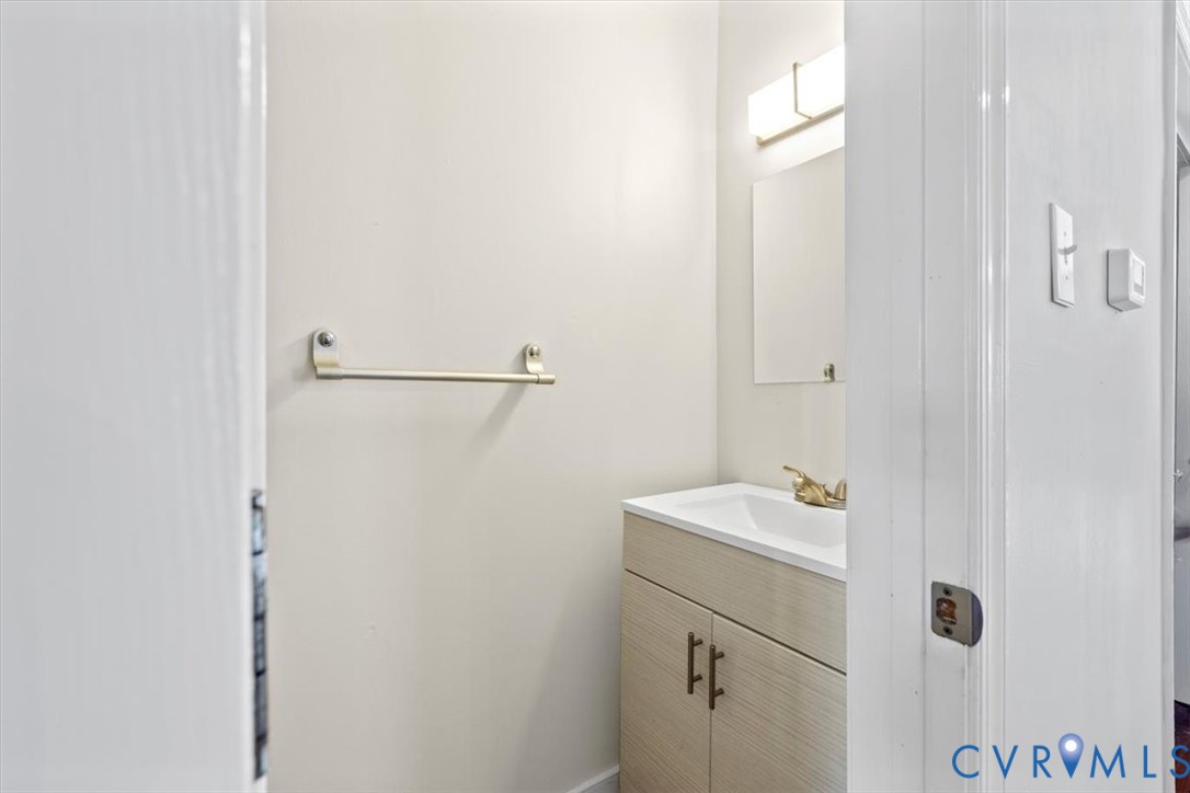 1606 Decatur Street Richmond, VA 23224 - Photo 12 of 24 a bathroom with a sink and a mirror