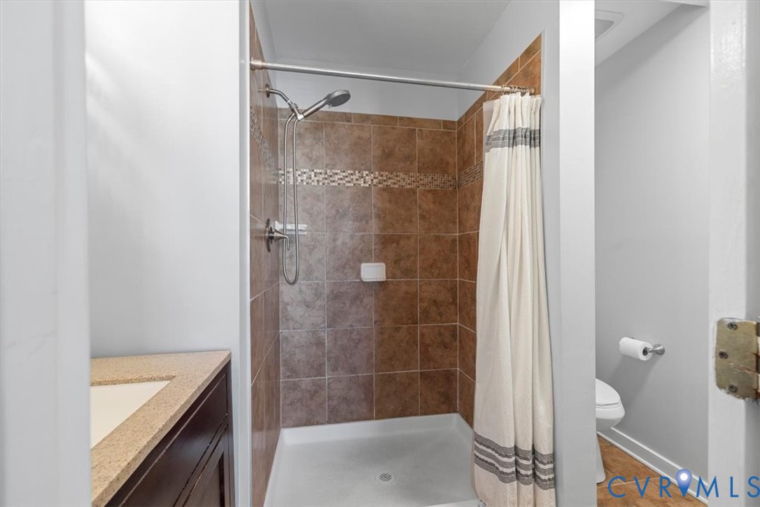 1606 Decatur Street Richmond, VA 23224 - Photo 15 of 24 a bathroom with a shower and a toilet