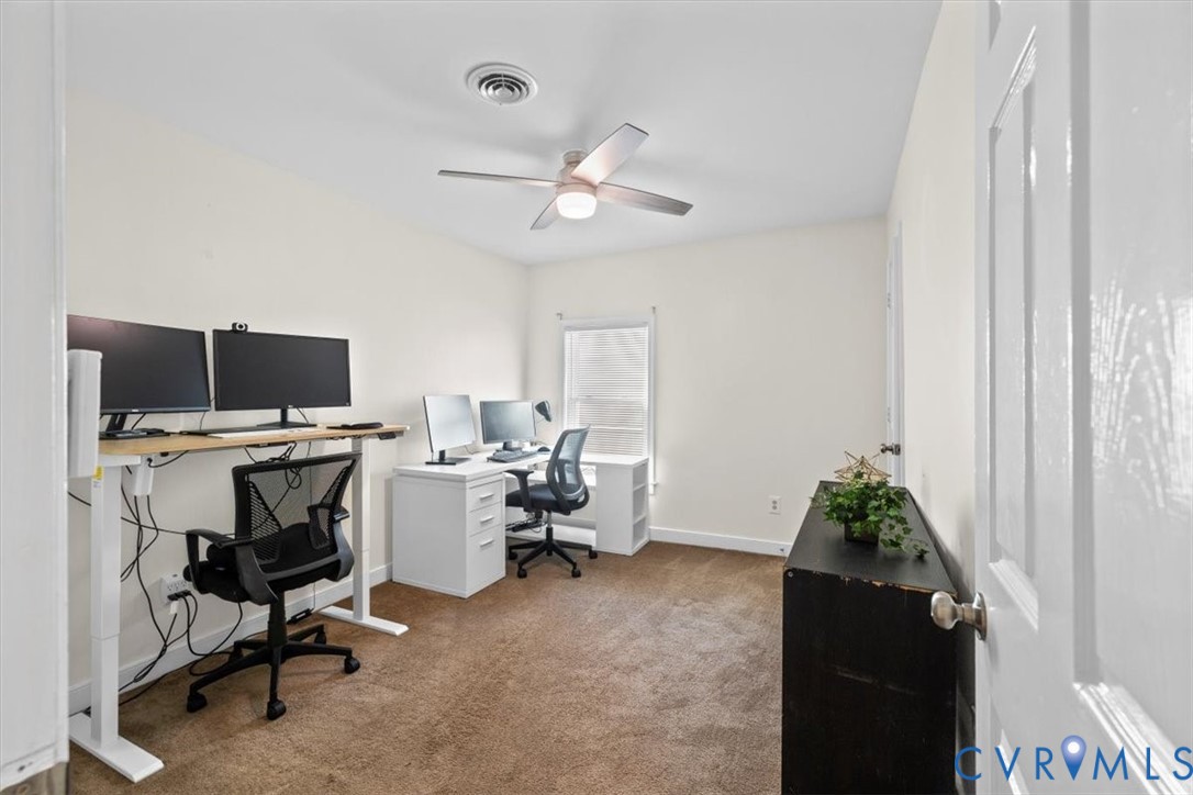 1606 Decatur Street Richmond, VA 23224 - Photo 18 of 24 a view of a workspace with furniture and a window