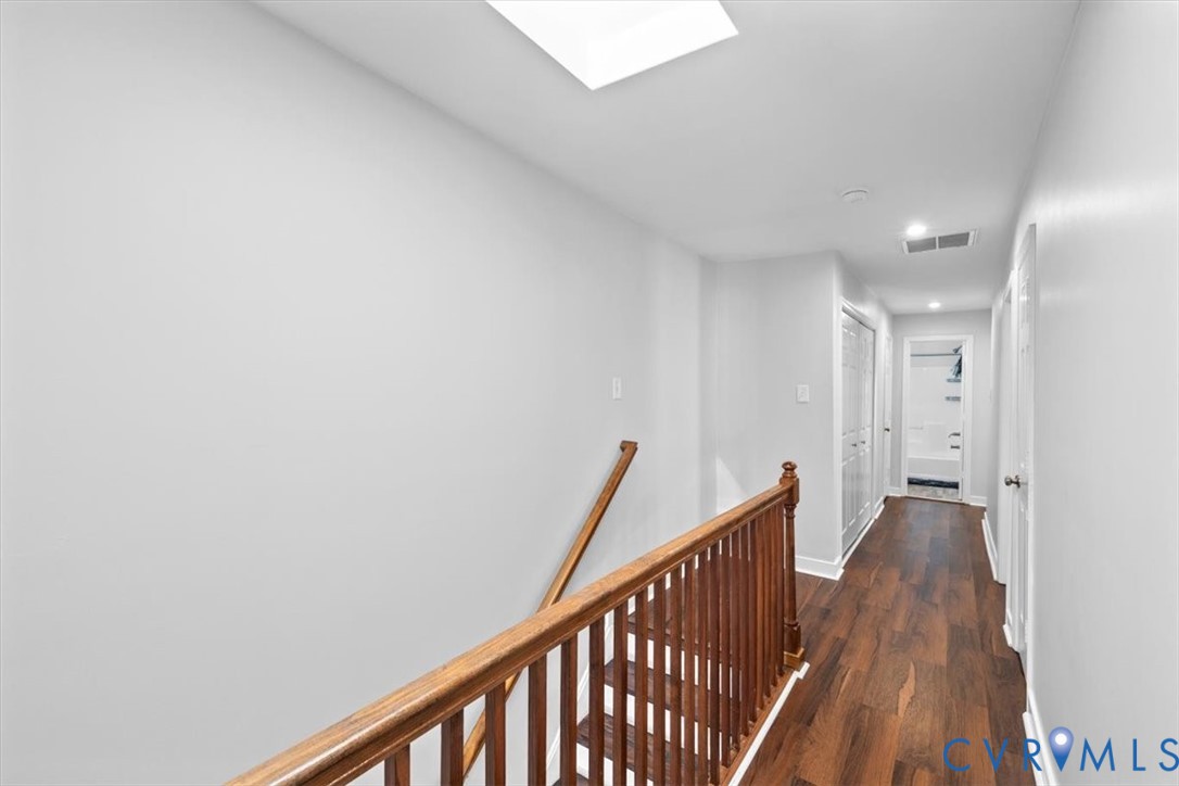 1606 Decatur Street Richmond, VA 23224 - Photo 20 of 24 a view of a hallway with wooden floor and staircase