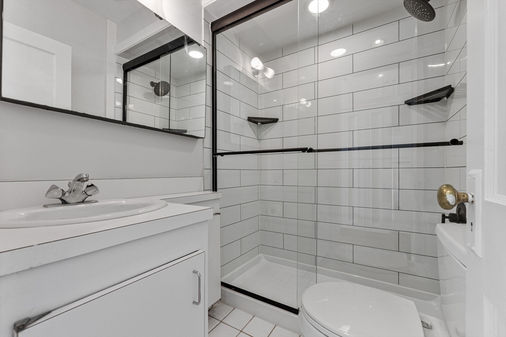 396 Beacon Street, Unit 3 Boston, MA 02116 - Photo 9 of 18 a bathroom with a sink a toilet and shower