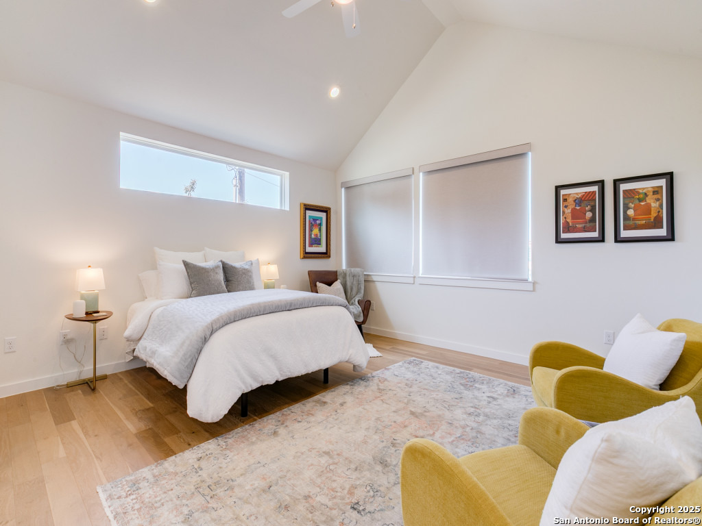 133 Terrell Road, Unit 1 Alamo Heights, TX 78209 - Photo 15 of 25 a bedroom with a bed couch and painting on the wall