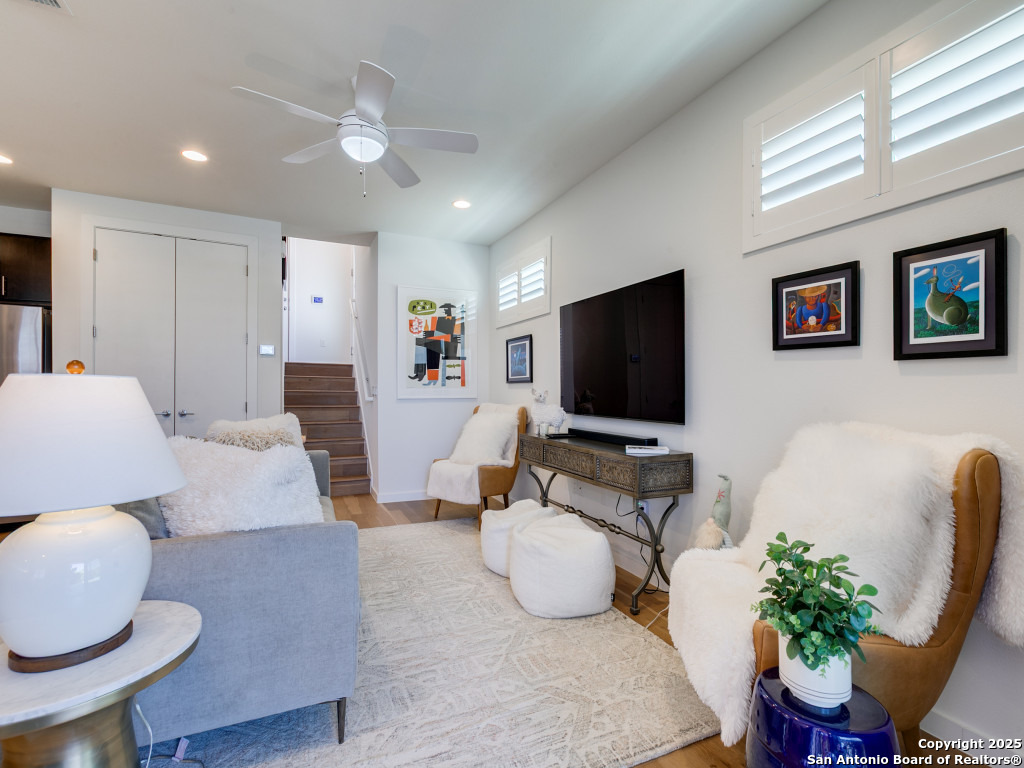 133 Terrell Road, Unit 1 Alamo Heights, TX 78209 - Photo 4 of 25 a living room with furniture and a flat screen tv