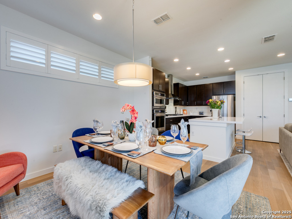 133 Terrell Road, Unit 1 Alamo Heights, TX 78209 - Photo 8 of 25 a view of a dining room with furniture