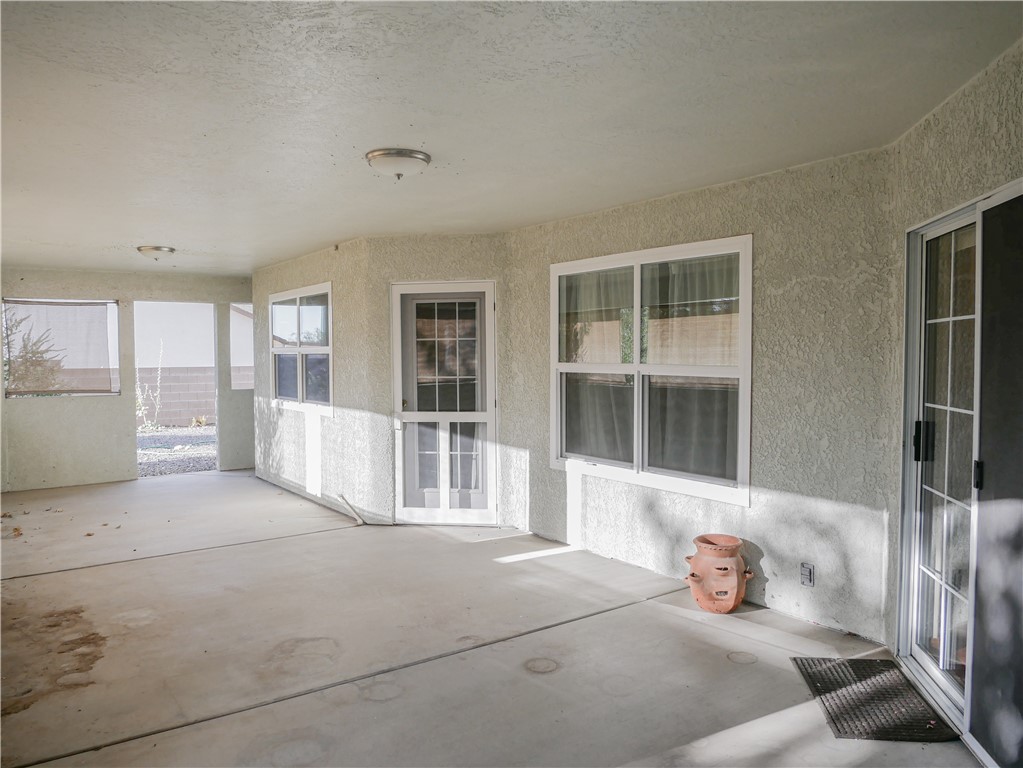 2575 Triangle S Street Kingman, AZ 86401 - Photo 34 of 45 a bedroom with furniture and large windows