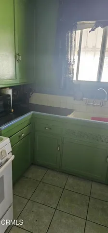 a room with a window and a washer dryer