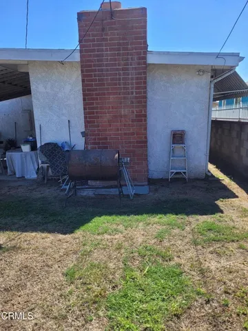 a view of backyard with seating space