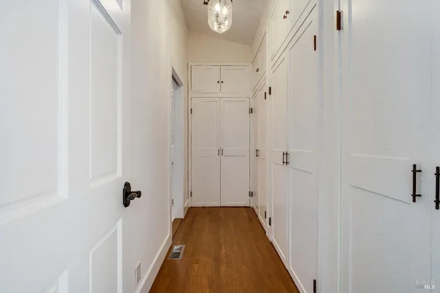 an aerial view of a house with a yard and lake view