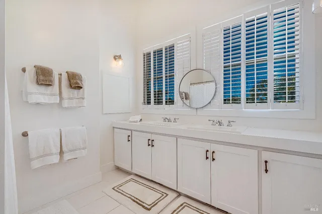 a front view of a house with a yard and a garage