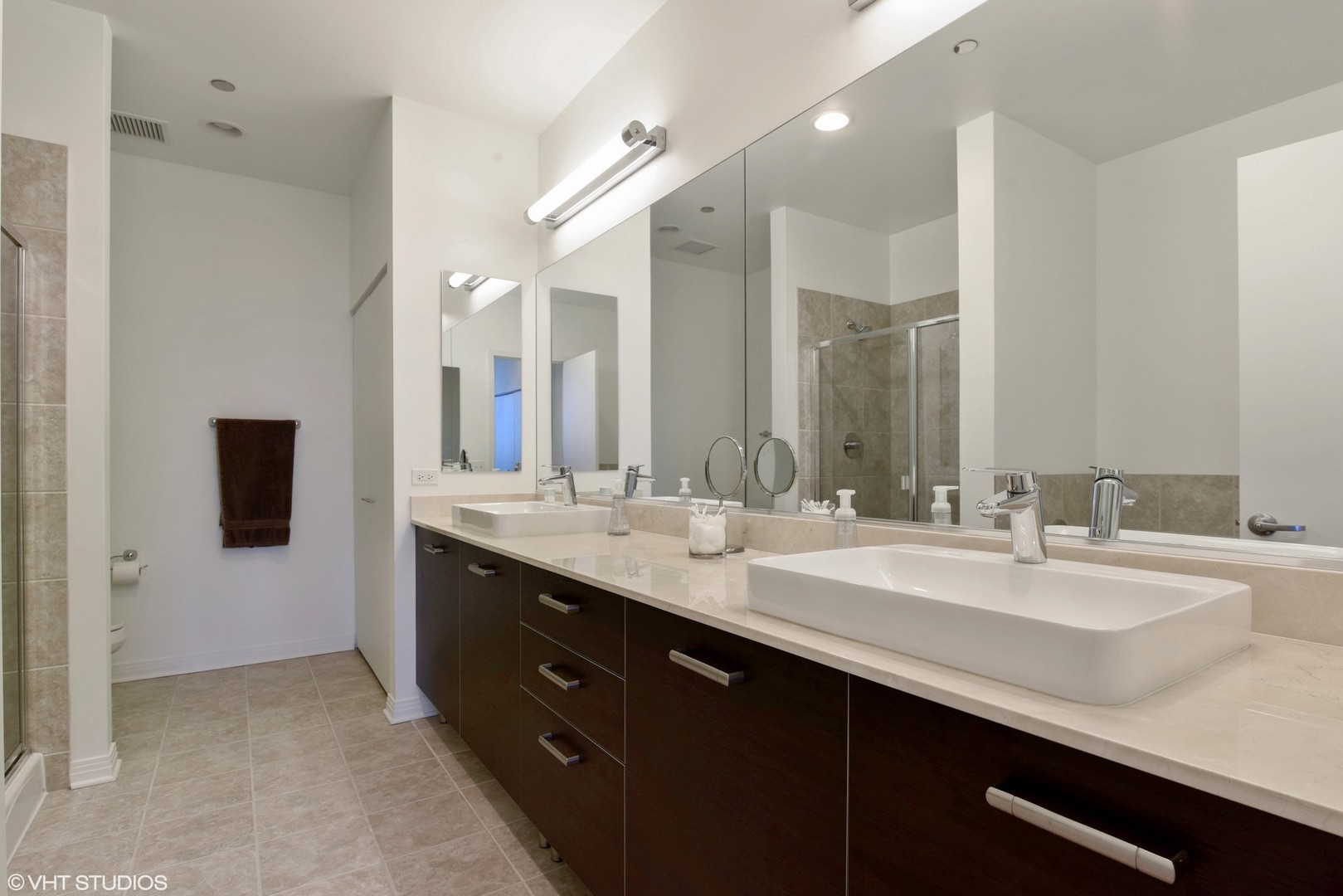 65 East Monroe Street, Unit 4015 Chicago, IL 60603 - Photo 7 of 14 a spacious bathroom with a double vanity sink and mirror