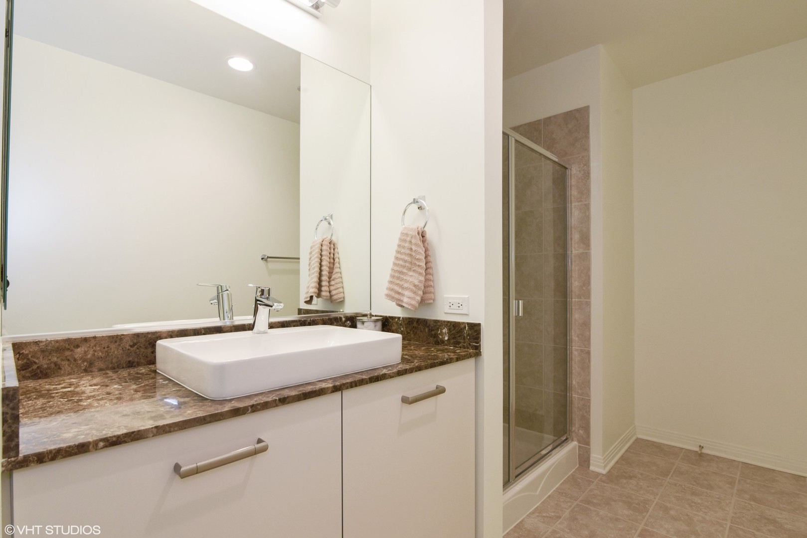 65 East Monroe Street, Unit 4015 Chicago, IL 60603 - Photo 9 of 14 a bathroom with a sink and a mirror