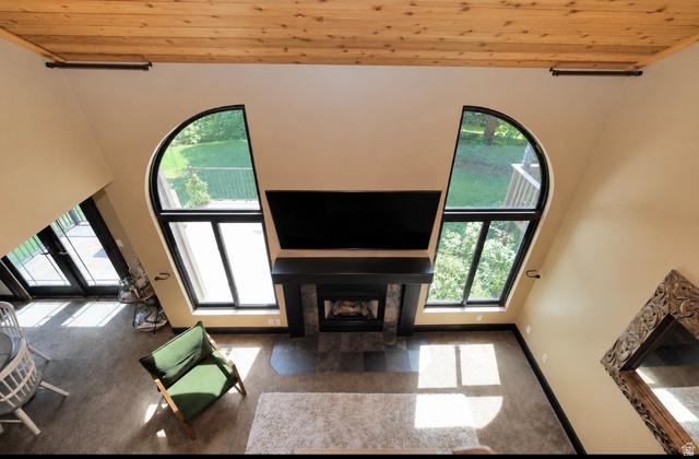 3104 East High Danish Road Sandy, UT 84093 - Photo 18 of 36 High ceilings with wood-plank finish and black accent beams create an expansive atmosphere