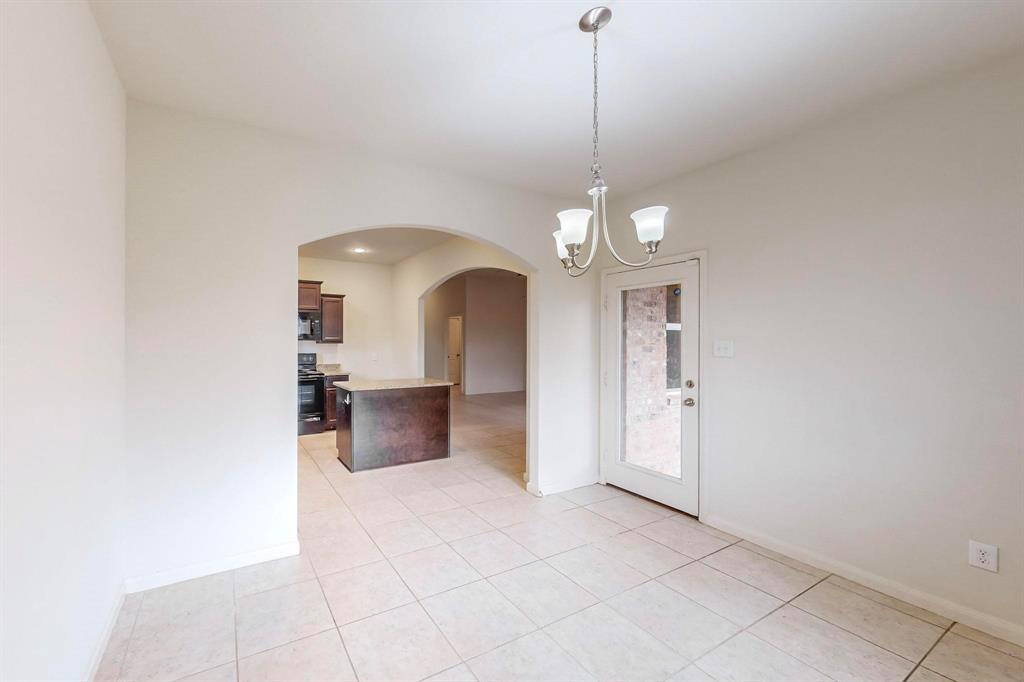 10 Kramer Court Sanger, TX 76266 - Photo 18 of 38 a view of a room with a chandelier and living room