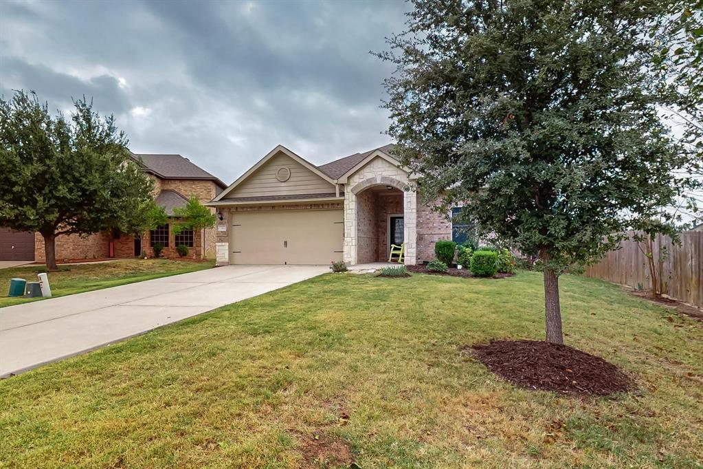 10 Kramer Court Sanger, TX 76266 - Photo 3 of 38 a front view of a house with a garden