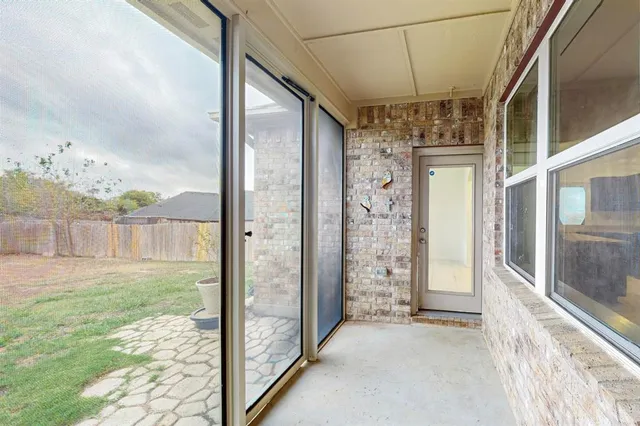 a view of a glass door with a porch