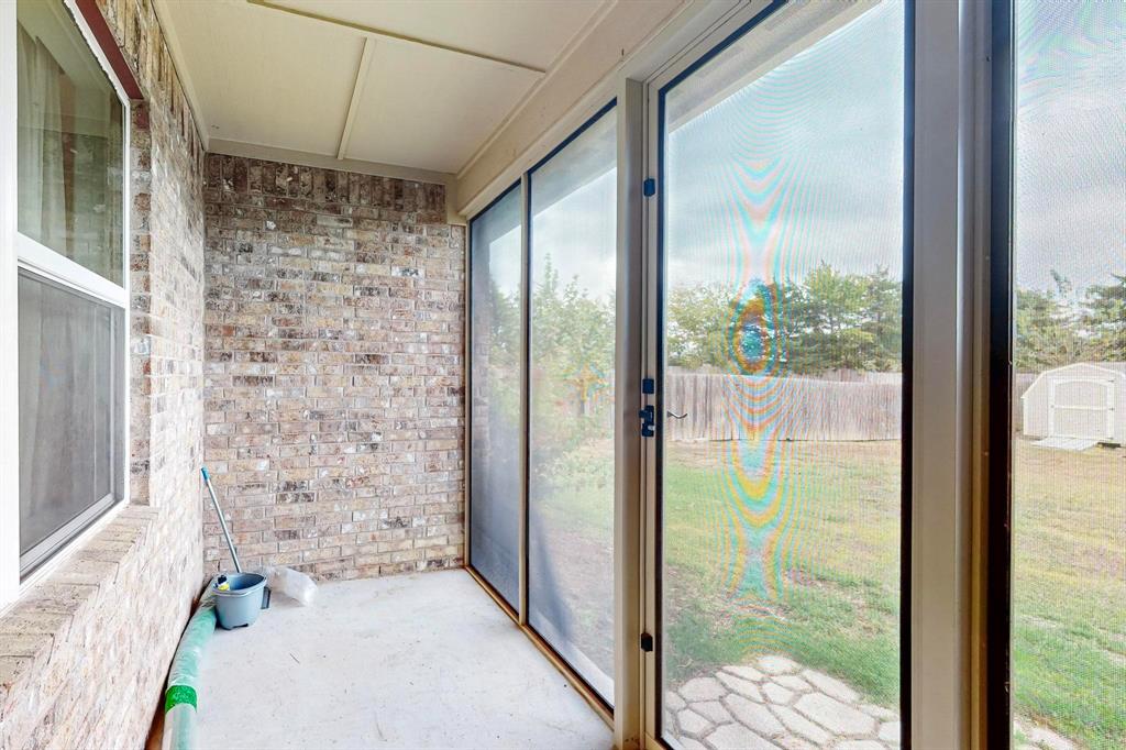 10 Kramer Court Sanger, TX 76266 - Photo 35 of 38 a view of a glass door with a porch