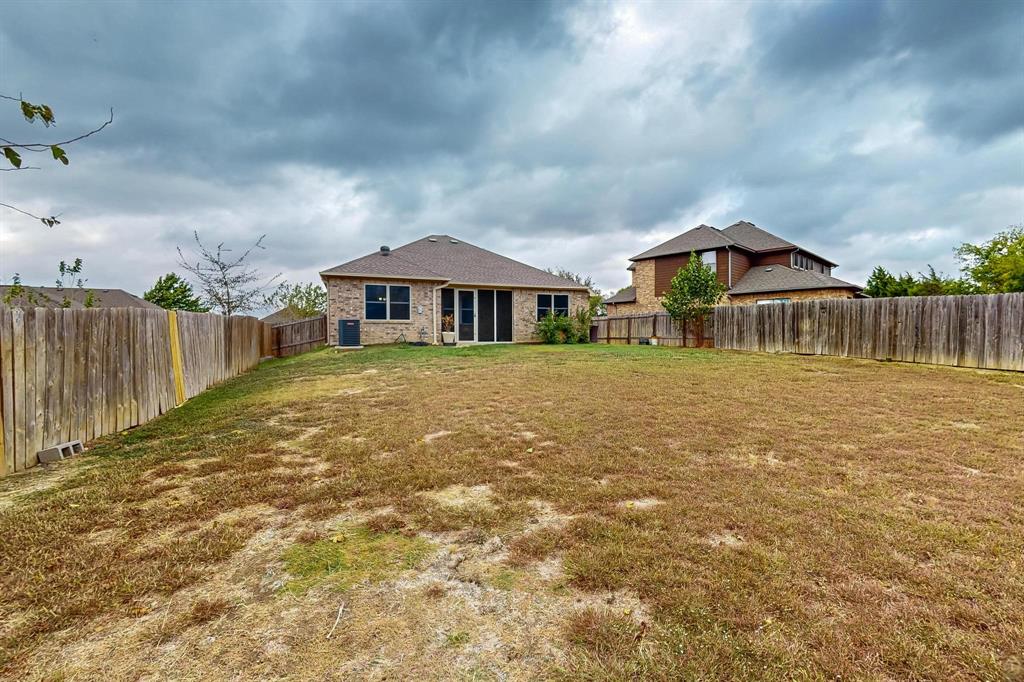 10 Kramer Court Sanger, TX 76266 - Photo 37 of 38 a view of a house with a yard