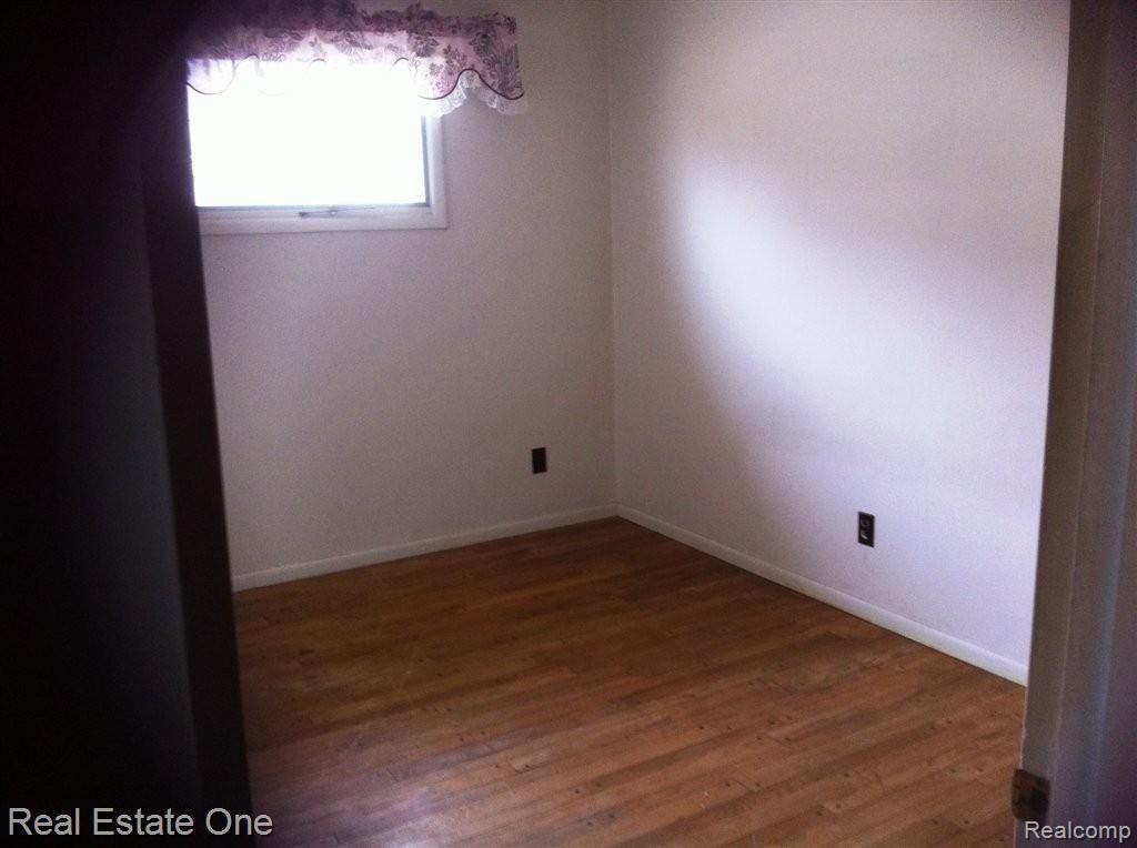 11381 Hall Road Whitmore Lake, MI 48189 - Photo 18 of 21 PEGGED HARDWOOD FLOORS UNDER CAR