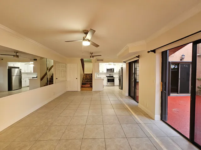 a view of an entryway with wooden floor