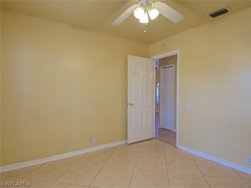 17525 Lee Road Fort Myers, FL 33967 - Photo 15 of 24 an empty room with a bathroom