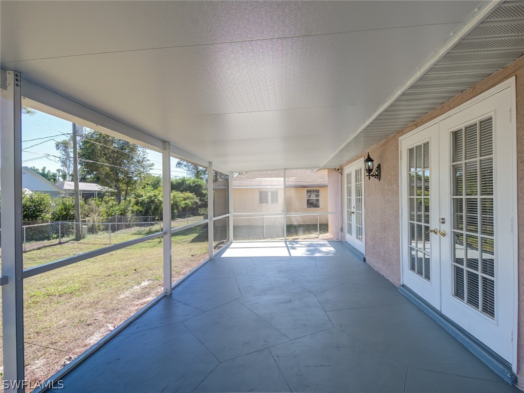 17525 Lee Road Fort Myers, FL 33967 - Photo 20 of 24 a view of an empty room with a large window