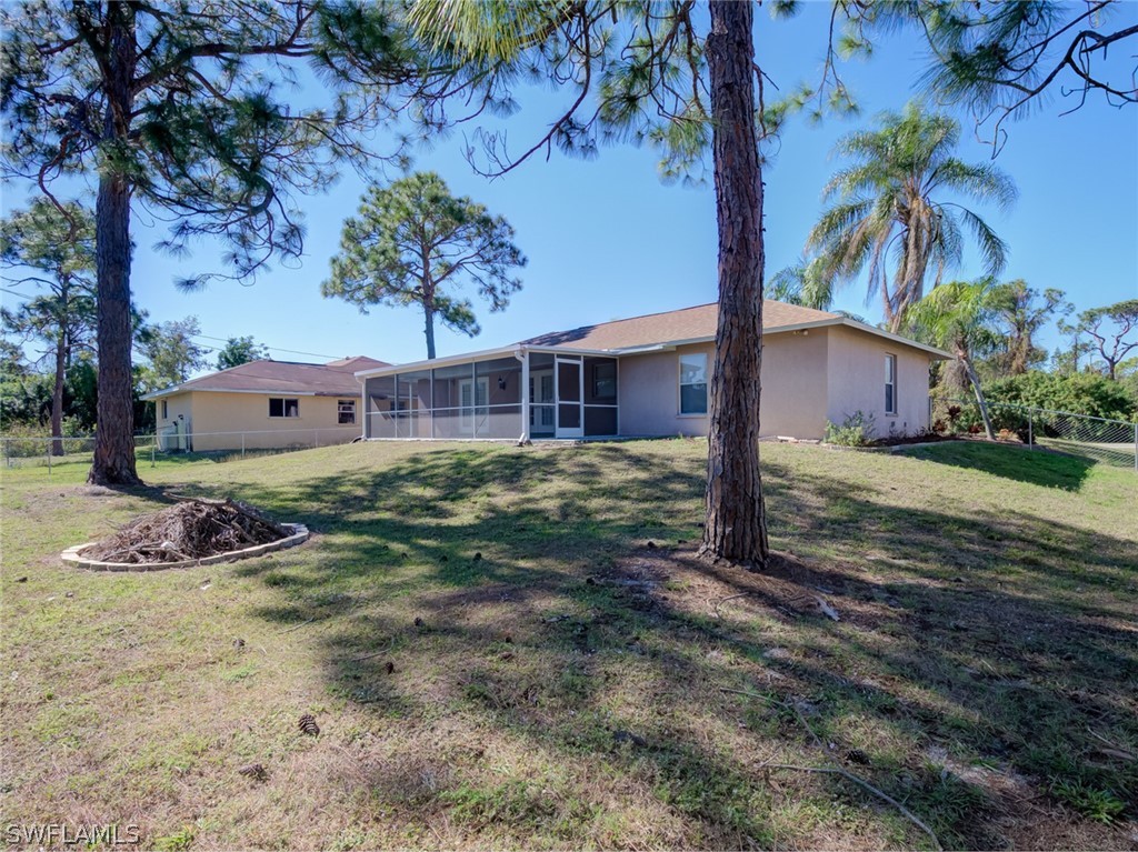 17525 Lee Road Fort Myers, FL 33967 - Photo 22 of 24 a view of a house with a yard