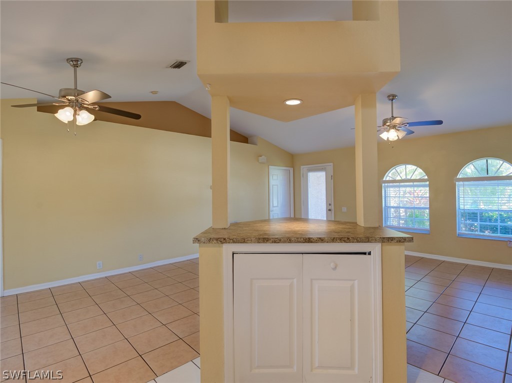 17525 Lee Road Fort Myers, FL 33967 - Photo 6 of 24 a bathroom with a granite countertop sink a mirror and a vanity