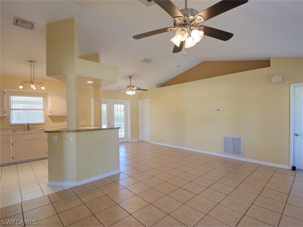 17525 Lee Road Fort Myers, FL 33967 - Photo 7 of 24 a view of an empty room and window chandelier fan