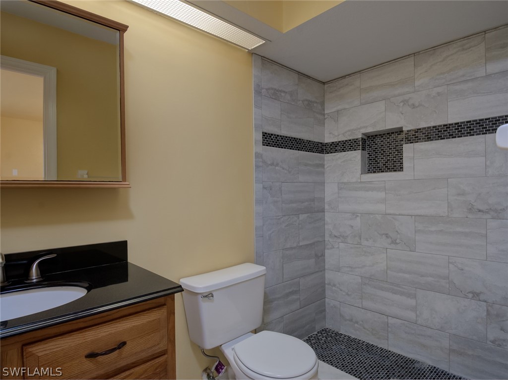 17525 Lee Road Fort Myers, FL 33967 - Photo 10 of 24 a bathroom with a toilet and a sink
