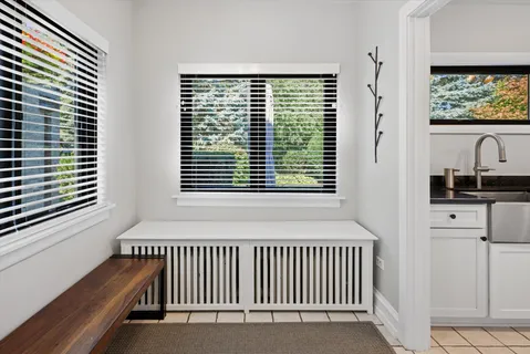 a view of a room with furniture and windows