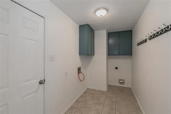 a kitchen with granite countertop sink and cabinets