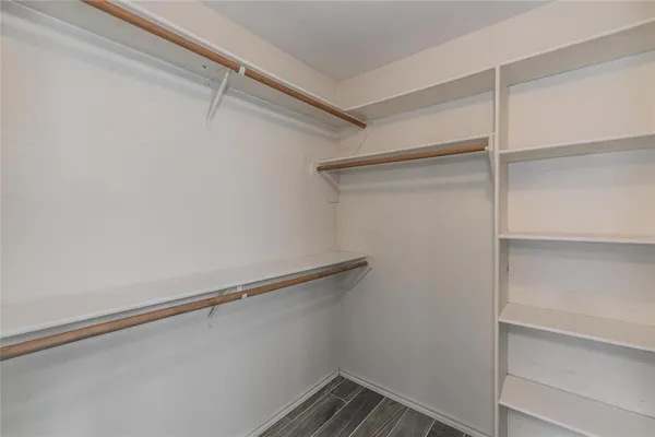 a view of an empty walk in closet