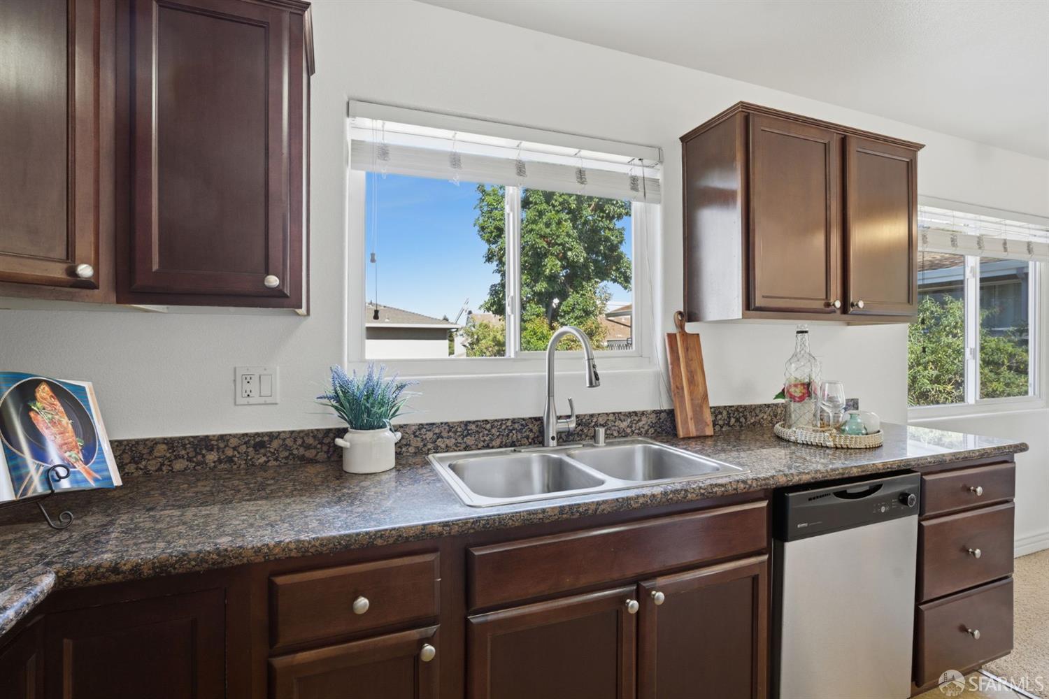 4970 Cherry Avenue, Unit 211 San Jose, CA 95118 - Photo 12 of 67 a kitchen with granite countertop a sink and a window