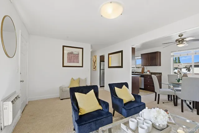 a living room with furniture and a table