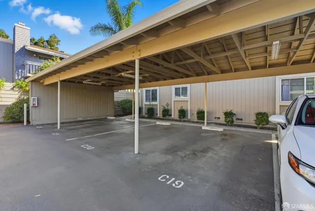 an aerial view of residential houses with city view