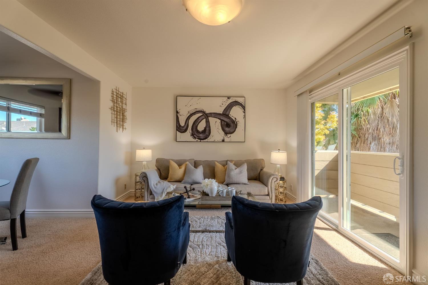 4970 Cherry Avenue, Unit 211 San Jose, CA 95118 - Photo 39 of 67 a living room with furniture and a large window