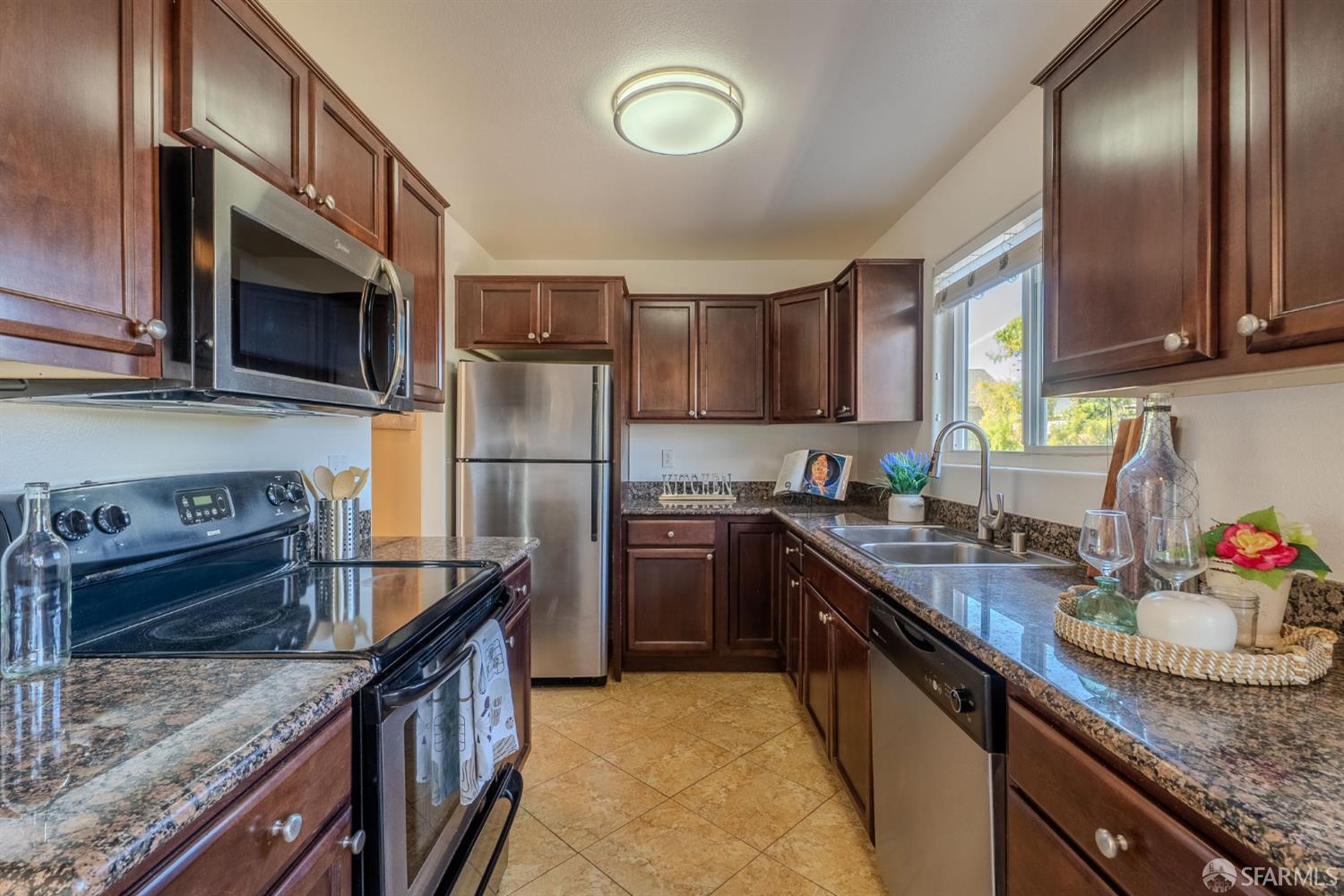 4970 Cherry Avenue, Unit 211 San Jose, CA 95118 - Photo 40 of 67 a kitchen with stainless steel appliances granite countertop a sink stove and refrigerator