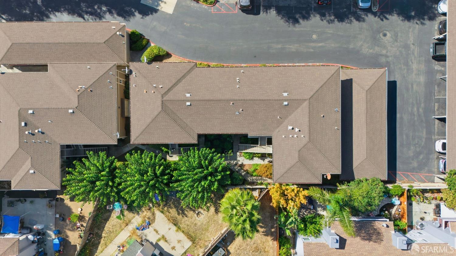 4970 Cherry Avenue, Unit 211 San Jose, CA 95118 - Photo 45 of 67 an aerial view of a house with a yard and a large tree