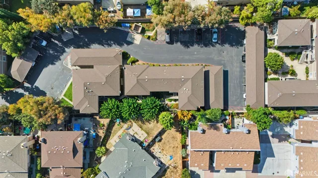 an aerial view of a house with yard