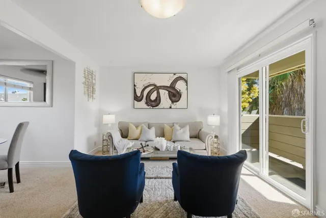 a kitchen with granite countertop a sink stove and cabinets