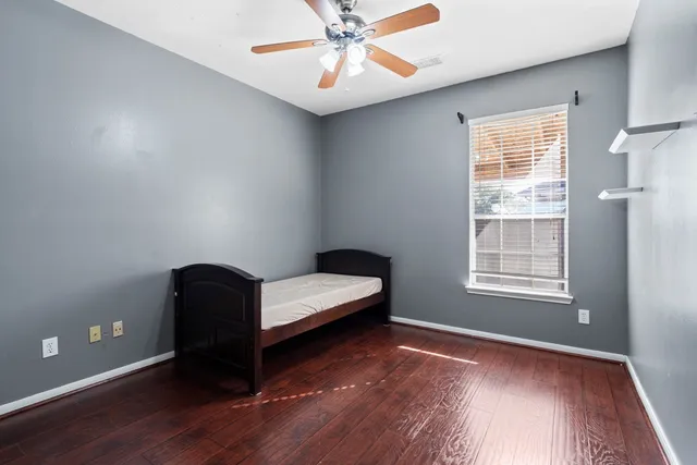 a bedroom with bed and window