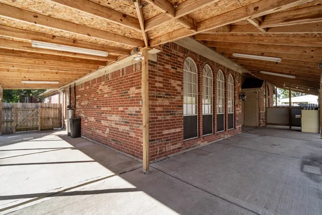 a patio with table and chairs